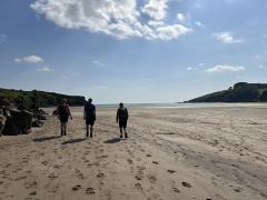 Excitement over- heading off up the beach to rejoin the path